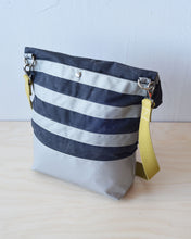 Load image into Gallery viewer, The snap at the back opens to a deep pocket. At 14", most laptops slip right in.