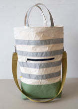 Load image into Gallery viewer, The Urban Field bag has a 4inch gusset, wide enough to stand upright when loaded. Fully stretched out the bag is 21" from the bottom to the rim, (showing the iridescent silver handle version).