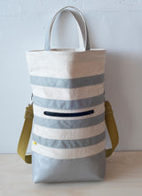 Load image into Gallery viewer, The Urban Field bag has a 4inch gusset, wide enough to stand upright when loaded. Fully stretched out the bag is 21" from the bottom to the rim, (showing the iridescent silver handle version).